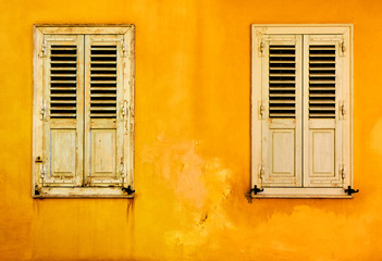 Yellow wall with two windows