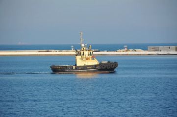 Tugboat in harbor quayside