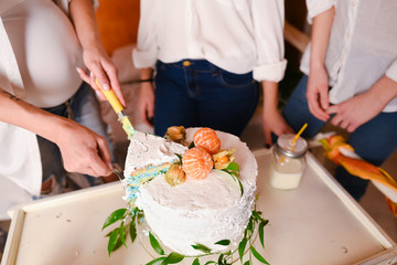Obraz na płótnie Canvas Gender reveal cake with mandarins on baby shower party