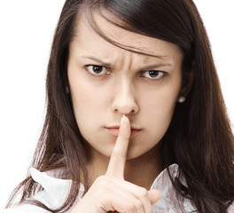 Fototapeta premium young serious business woman ,putting a finger to her lips