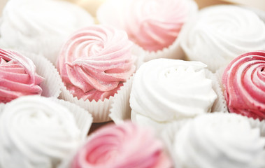 food, confection and sweets concept - close up of zephyr or marshmallow dessert on plate