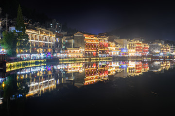 Scenic colorful traditional Chinese buildings reflected in water