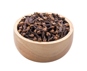 cloves spices in wood bowl on white background