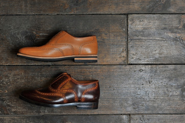 leather handmade shoes on a wooden background