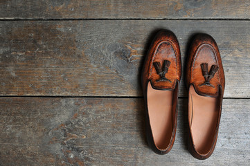 leather handmade shoes on a wooden background