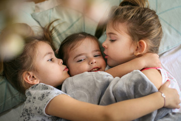 Kiss for little sister.