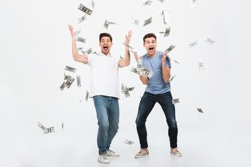 Obraz premium Full length portrait of two happy young men