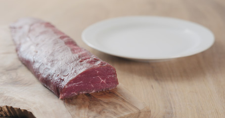 raw beef fillet for steak on wooden board