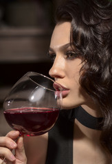 beautiful young girl with glass of wine