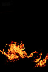 Fire flame isolated on black isolated background - Beautiful yellow, orange and red and red blaze fire flame texture style.