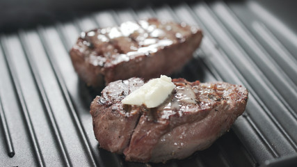 Fototapeta na wymiar preparing steak filet mignon with butter