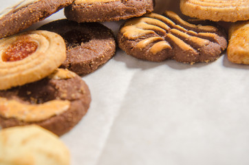 assorted cookies on wooden tray