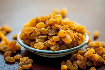 A sweet dried fruit Golden raisins or Vitis vinifera L. var. Apyrena , Kishmish or Zante currant on...