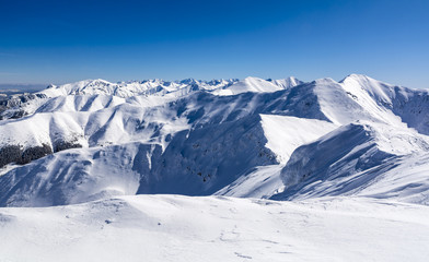 Mountain peaks covered with white snow.