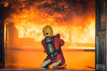Firefighters training, Team practice to fighting with fire in emergency situation..Spray twist...