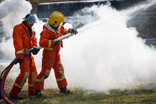 Firefighters training, Team practice to fighting with fire in emergency situation..Spray foam water to the flame