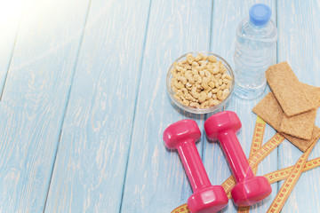 The concept of a healthy diet. Small dumbbells. healthy lifestyle. sport. Fitness food.
