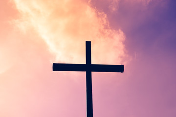 Black cross on a background of red and purple flaming sky, from heaven to earth fall fireballs, the concept of the end of the world, the Apocalypse and doomsday