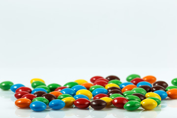 Chocolate dragee in multi-colored glaze
