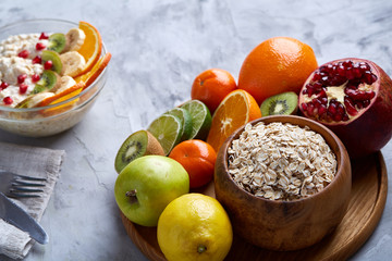 Breakfast still life with oatmeal and fruits, top view, selective focus, shallow depth of field.