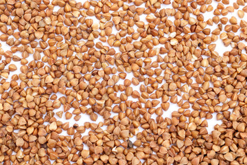 fresh dry buckwheat on white background. Top view.