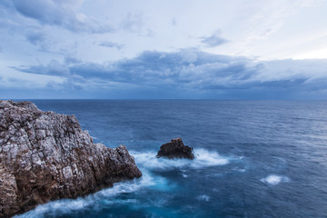 Waves breaking in the rocks