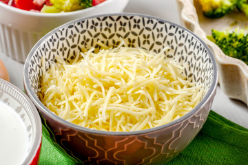 grated cheese in small bowl
