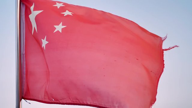 Chinese red flag flutters in wind