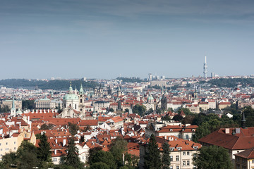 Fototapeta na wymiar The historical centre of Prague. The European urban landscape. Red rooftops, towers, and cathedrals