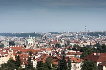 Deurstickers The historical centre of Prague. The European urban landscape. Red rooftops, towers, and cathedrals © Bakulov