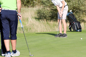 A golf player on a green