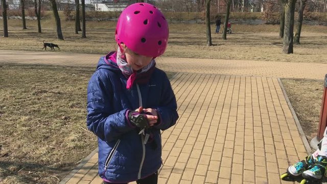 Little girl rollerskating.