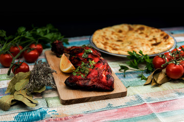 Traditional Indian food chicken tandoori and Tikka with garlic naan