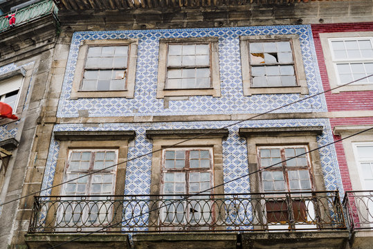 Grungy windows in building in Porto, Portugal