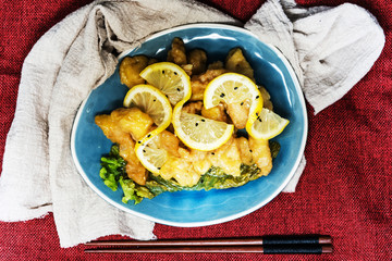 Chinese food fried fish and lemon slices