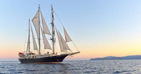 Cercles muraux Naviguer Sailing ship and beautiful sunset in the sea.  Yachting. Sailing