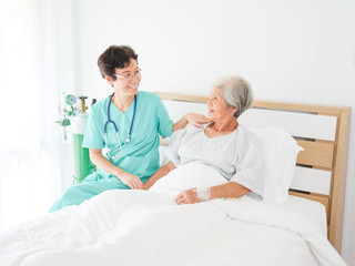 Asian old woman with doctor in the room  hospital in happy mood