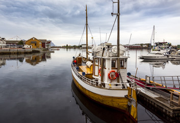 Fototapeta na wymiar Fishing boat in the port of Strønstad