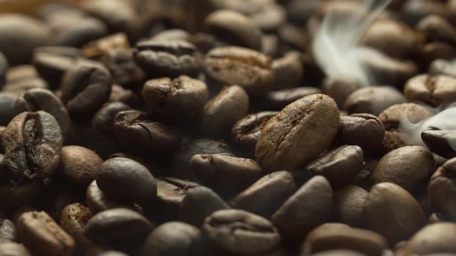 Fried coffee beans, delicious aroma, covered with smoke, roasted grain cafe flavor taste hot fresh smell morning 
