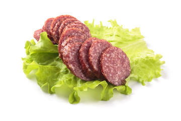 Slices of salami  isolated on  white .