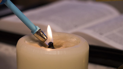 light of Christ (the lighter lights candles by Bible)