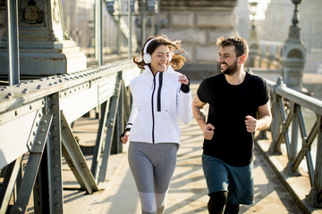 Fototapeta premium Young couple running in the morning