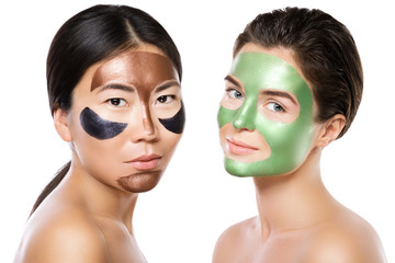Two beautiful girls with colorful peel-off masks on their faces