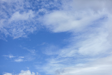 Naklejka na ściany i meble White clouds on a blue winter sky