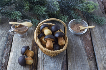 on the table, pine branches and biscuits in the form of mushrooms in a basket