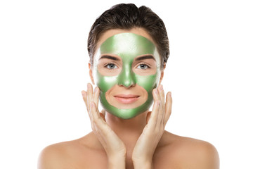 Woman with green peel-off mask on her face