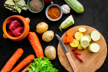 Diet vegetarian vegan food. Ratatouille or vegetable ragout. Black table background top view