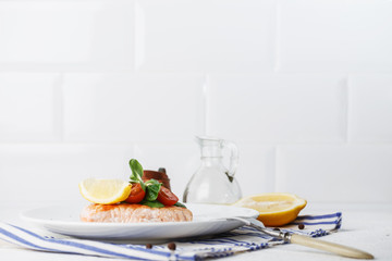 grilled salmon with cherry tomatoes and salad