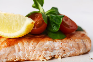 grilled salmon with cherry tomatoes and salad