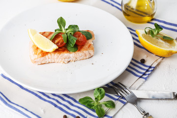 grilled salmon with cherry tomatoes and salad